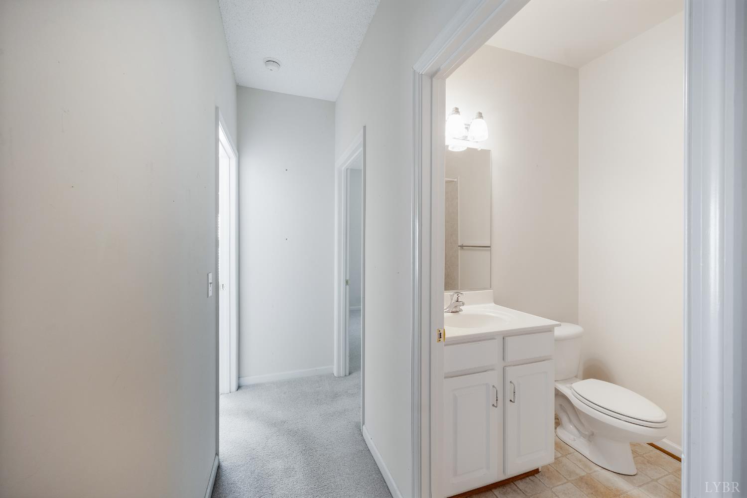1159 Jefferson Way Forest, VA 24551 - Photo 31 of 43 a bathroom with a toilet a sink and a mirror