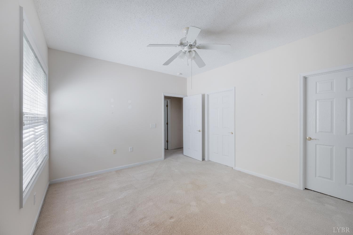 1159 Jefferson Way Forest, VA 24551 - Photo 33 of 43 an empty room with fan and windows