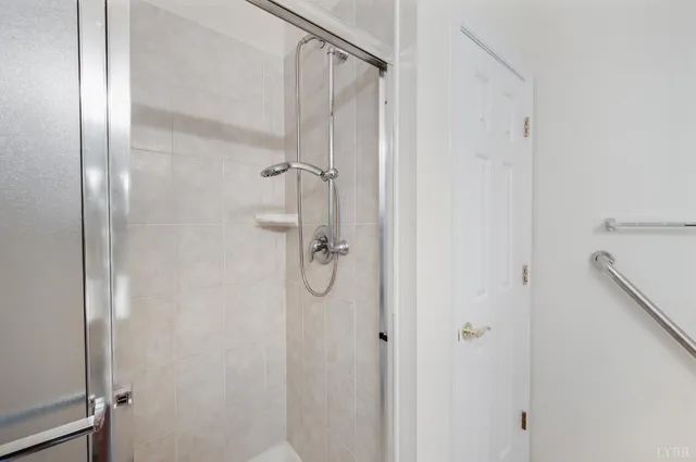 a bathroom with a glass shower door