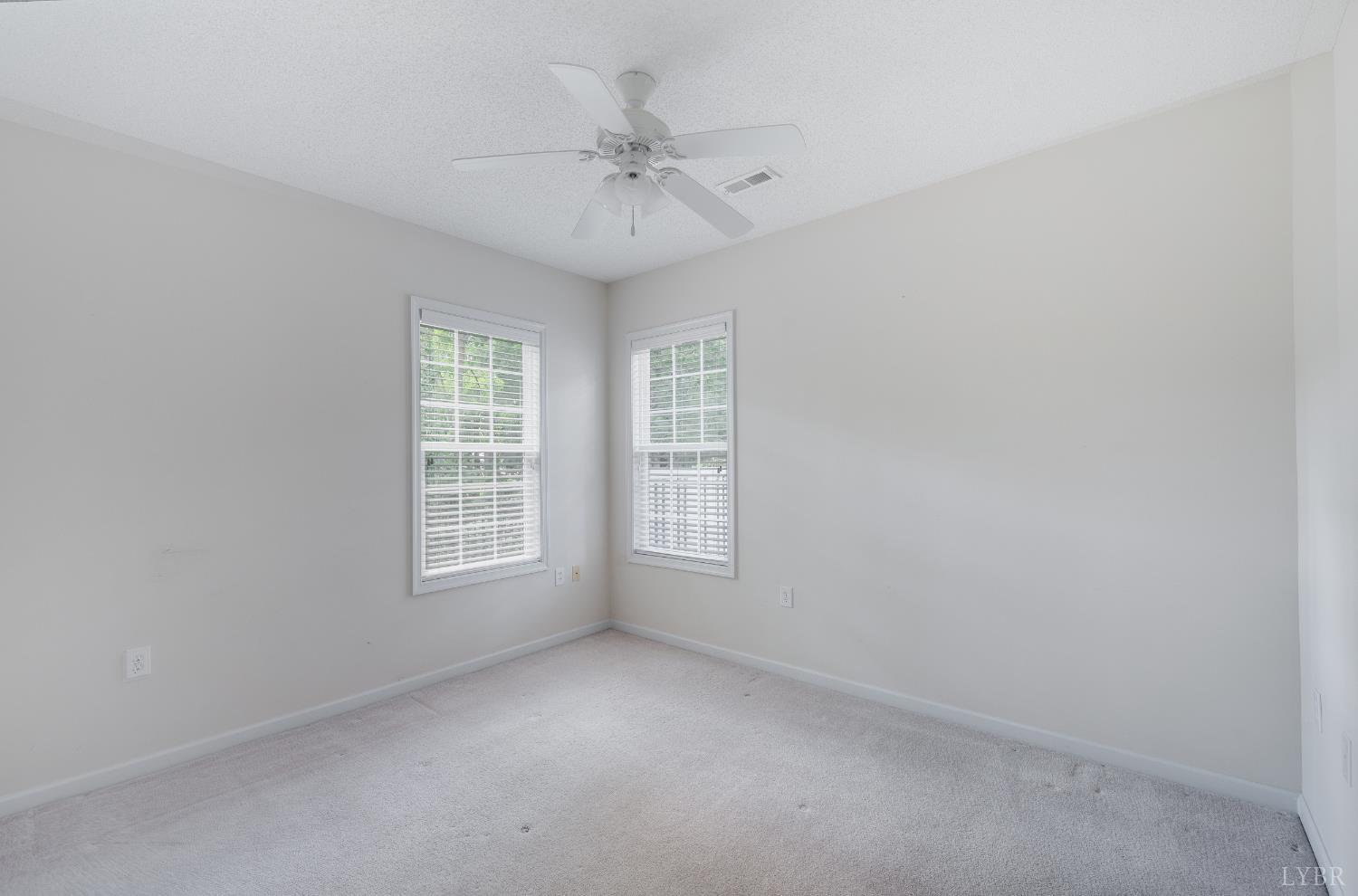 1159 Jefferson Way Forest, VA 24551 - Photo 8 of 43 an empty room with a window and a fan