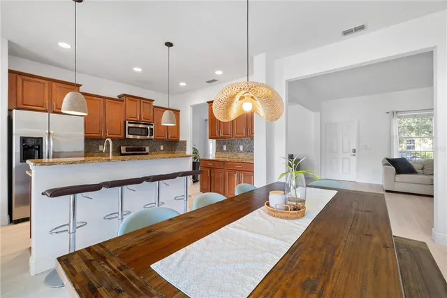 a large kitchen with kitchen island a large island in the center