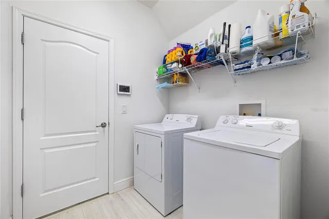 a bedroom with a bed and a chair