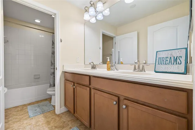 a bedroom with a bed window and a desk