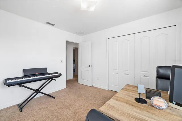 a bedroom with a bed and a chair