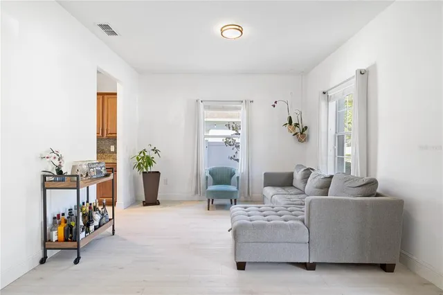 a kitchen with stainless steel appliances granite countertop a stove a sink and a wooden cabinets