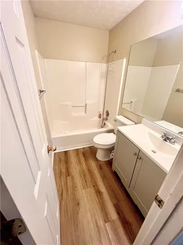 a bathroom with a sink toilet a tub and shower