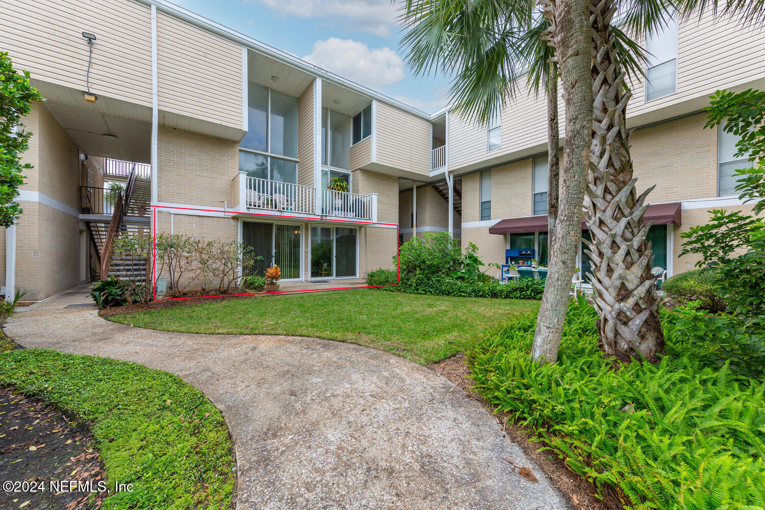 901 Ocean Boulevard, Unit 45 Atlantic Beach, FL 32233 - Photo 22 of 26 a front view of a house with a yard and garage