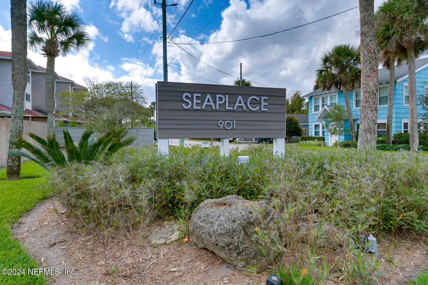 901 Ocean Boulevard, Unit 45 Atlantic Beach, FL 32233 - Photo 3 of 26 a view of sign board with buildings and trees around
