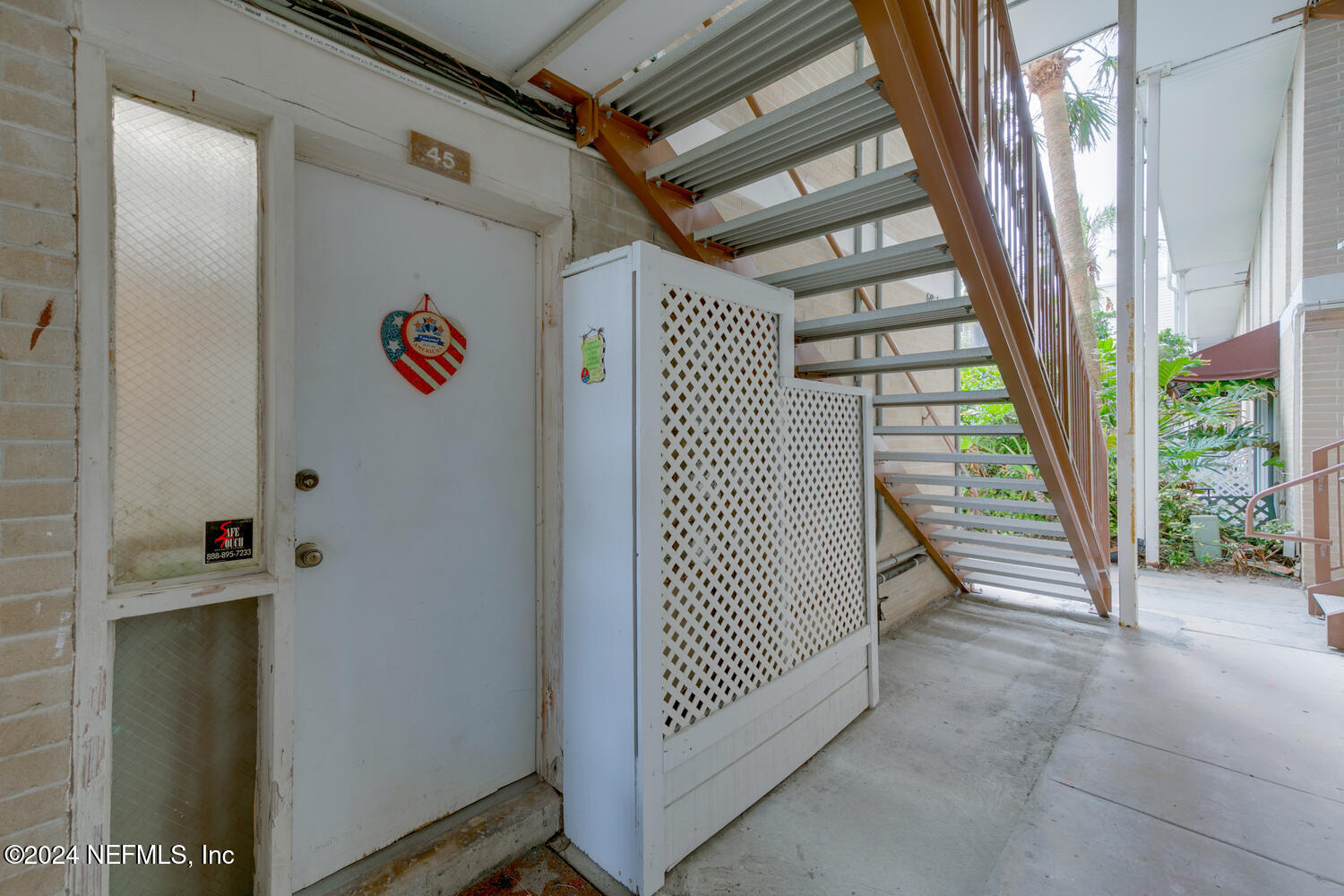 901 Ocean Boulevard, Unit 45 Atlantic Beach, FL 32233 - Photo 6 of 26 a view of a hallway with staircase
