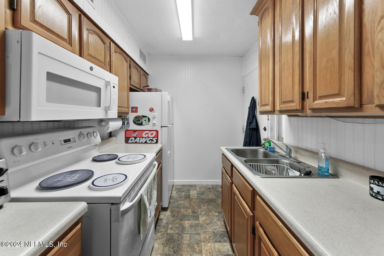 901 Ocean Boulevard, Unit 45 Atlantic Beach, FL 32233 - Photo 7 of 26 a utility room with dryer and washer