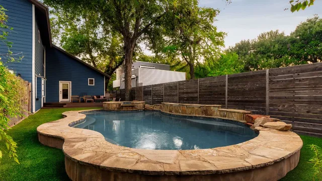 a view of a swimming pool with a patio