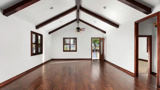 a view of an entryway with wooden floor and windows
