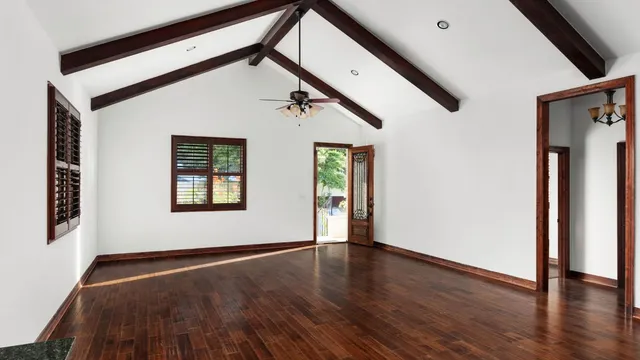 a view of an entryway with wooden floor and door