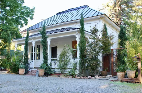 a front view of a house with garden