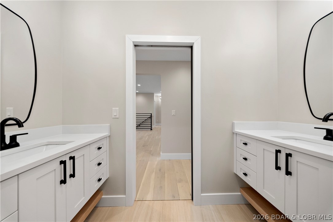439 Red Bud Road Lake Ozark, MO 65049 - Photo 62 of 98 Elegant Jack-and-Jill bathroom with dual vanities