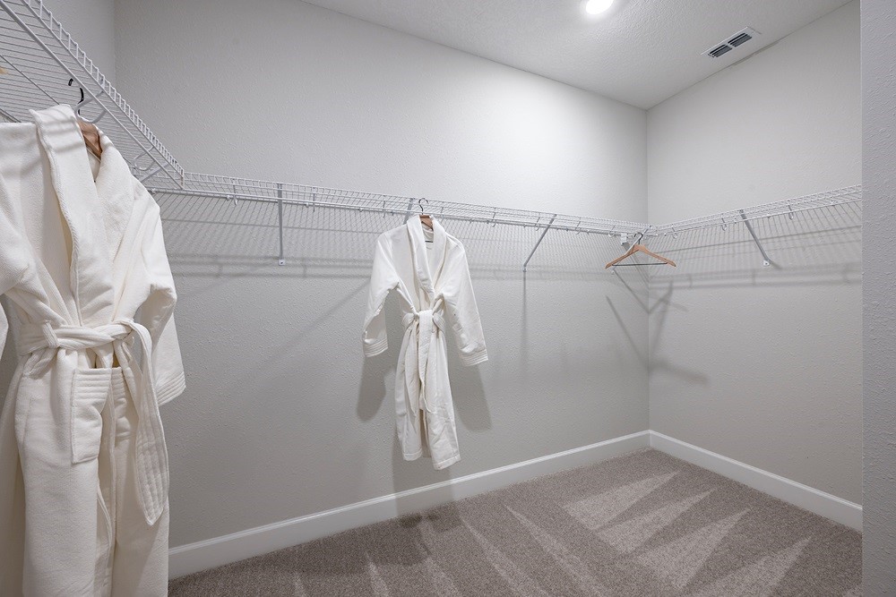 86646 Swift Launch Path Yulee, FL 32097 - Photo 16 of 30 a view of a room with racks on the wall