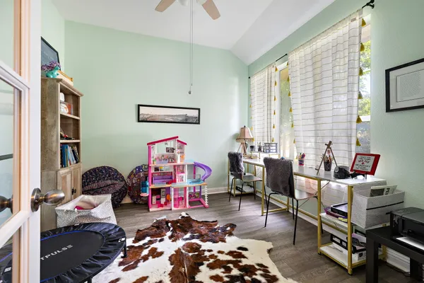 a bedroom with furniture and a window