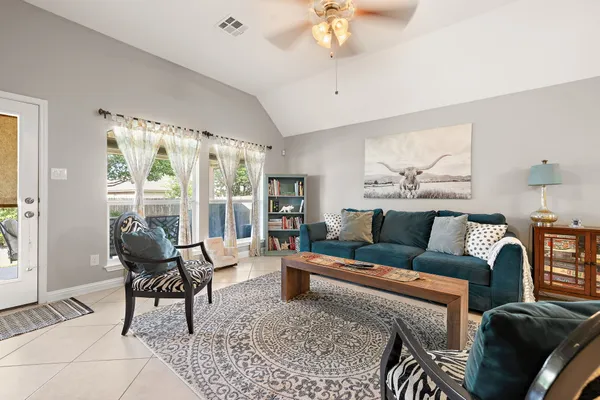 a living room with furniture and a large window