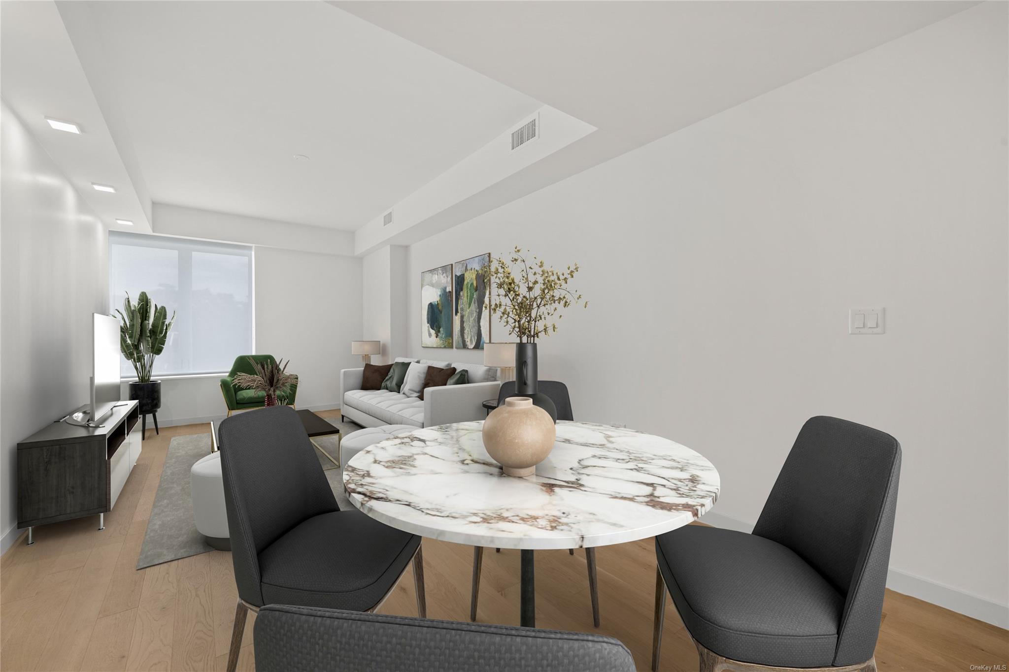 218 Middle Neck Road, Unit 314 Great Neck, NY 11021 - Photo 16 of 23 a dining room with furniture and wooden floor