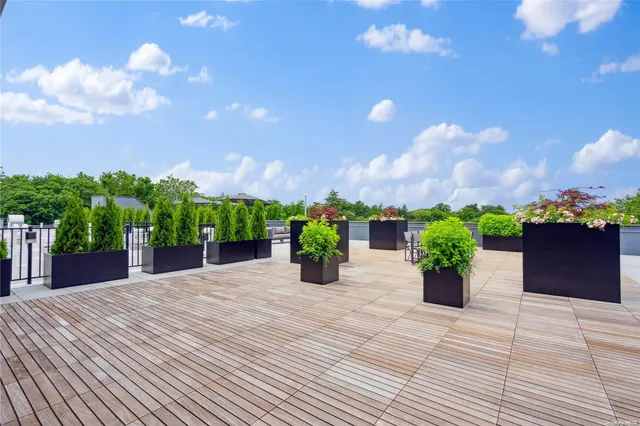 a house with a yard and potted plants