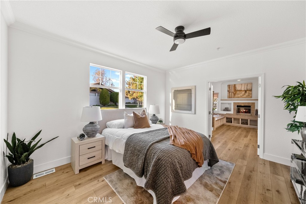 3909 Reche Road, Unit 60 Fallbrook, CA 92028 - Photo 12 of 37 a bedroom with a large bed and a potted plant