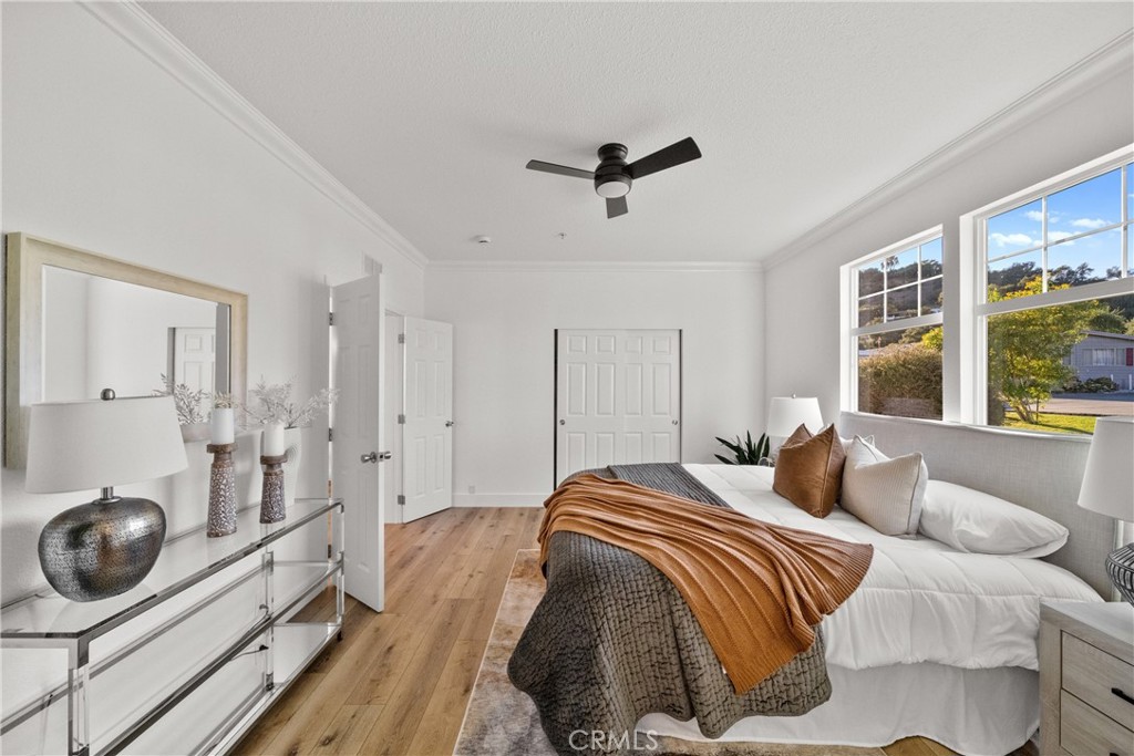 3909 Reche Road, Unit 60 Fallbrook, CA 92028 - Photo 14 of 37 a bedroom with a bed and a large window