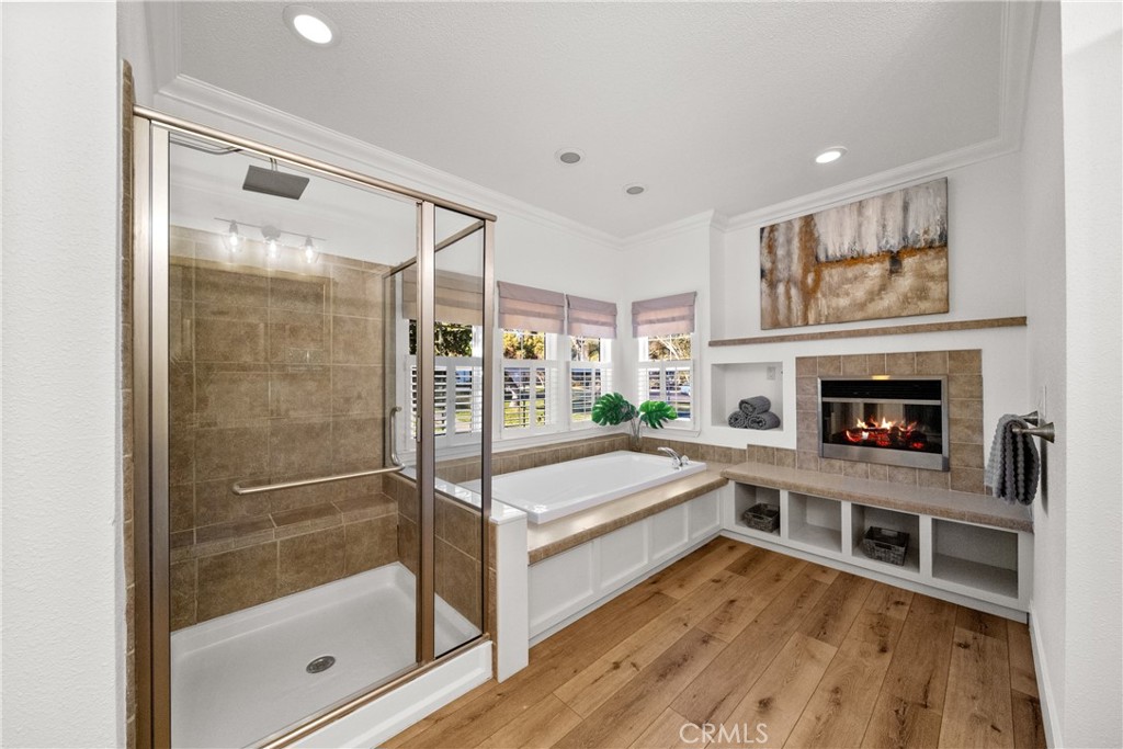 3909 Reche Road, Unit 60 Fallbrook, CA 92028 - Photo 17 of 37 a spacious bedroom with a bed and a fireplace