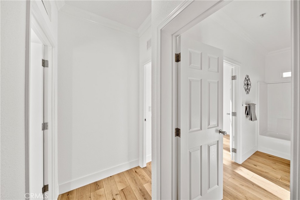 3909 Reche Road, Unit 60 Fallbrook, CA 92028 - Photo 20 of 37 a view of a bathroom with wooden floor