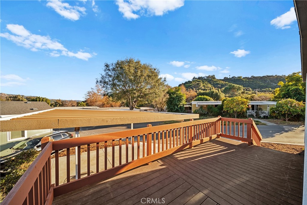 3909 Reche Road, Unit 60 Fallbrook, CA 92028 - Photo 26 of 37 a view of balcony with wooden floor and ocean view