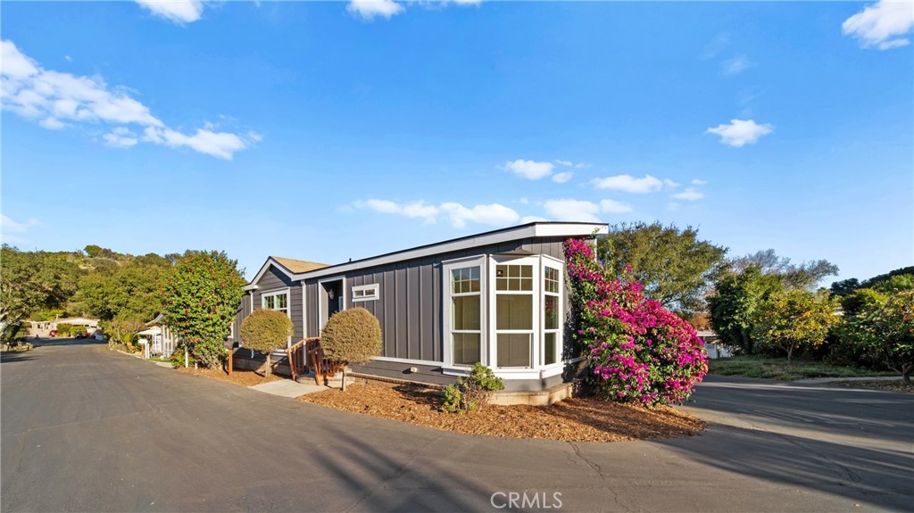 3909 Reche Road, Unit 60 Fallbrook, CA 92028 - Photo 28 of 37 a view of a chair and table in the backyard of a house