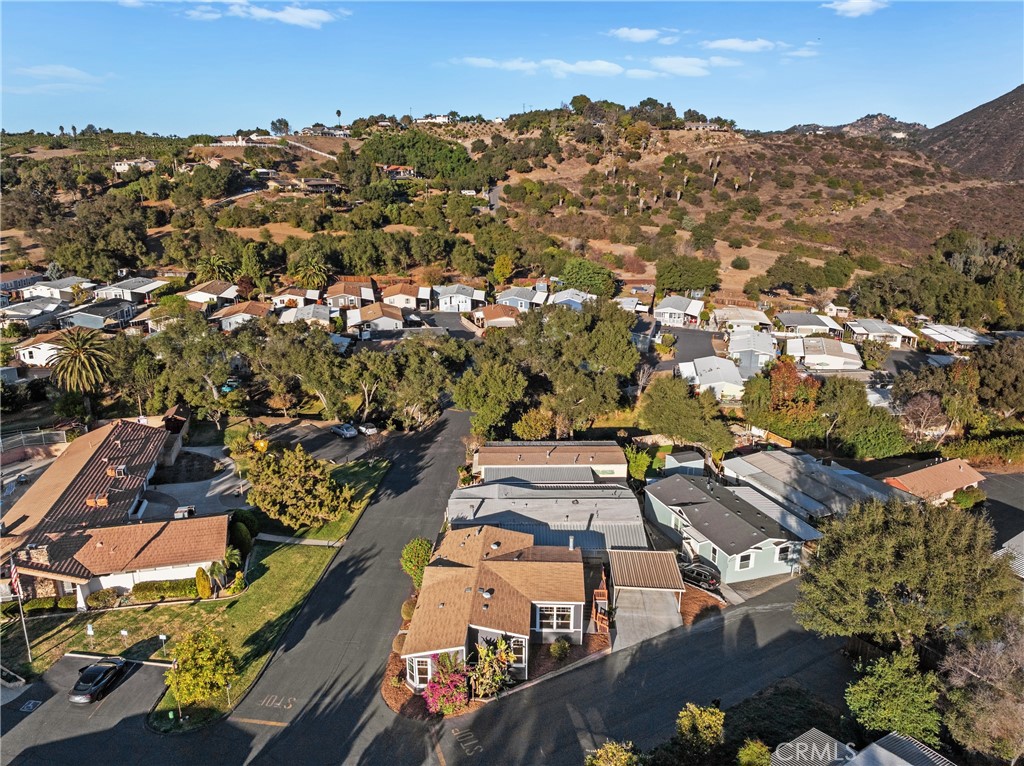 3909 Reche Road, Unit 60 Fallbrook, CA 92028 - Photo 31 of 37 an aerial view of residential houses with outdoor space