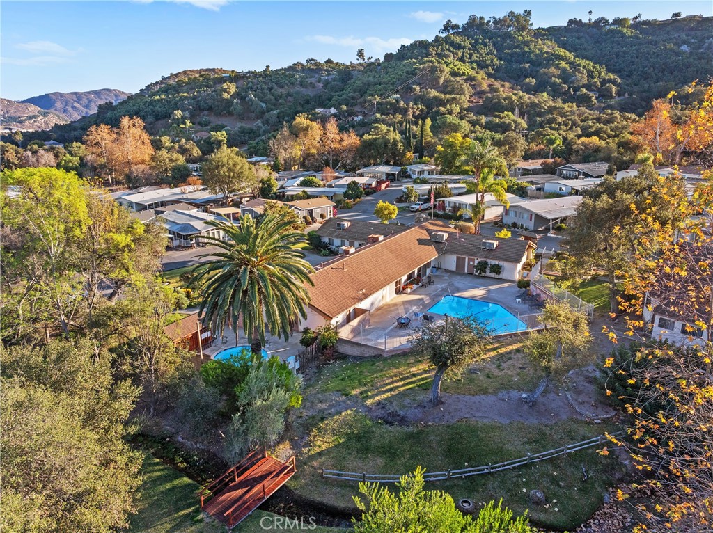 3909 Reche Road, Unit 60 Fallbrook, CA 92028 - Photo 33 of 37 an aerial view of residential houses with outdoor space