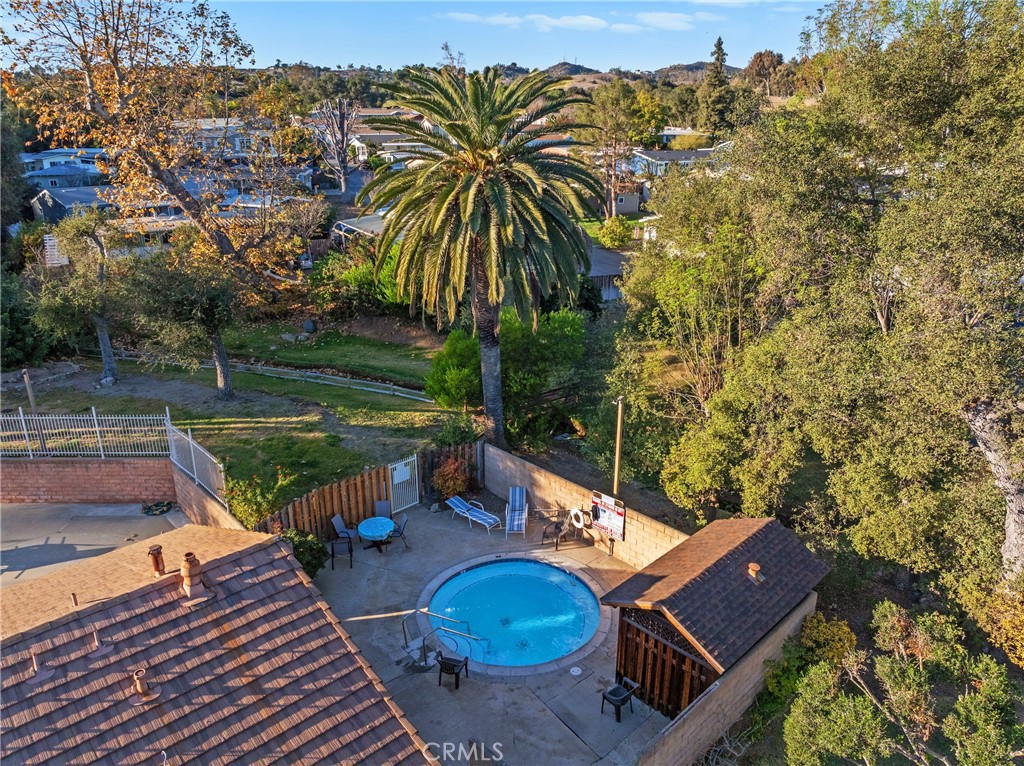 3909 Reche Road, Unit 60 Fallbrook, CA 92028 - Photo 34 of 37 a view of a backyard with plants and a patio