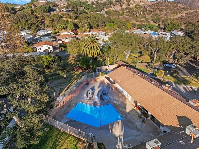 a view of a swimming pool with an outdoor seating