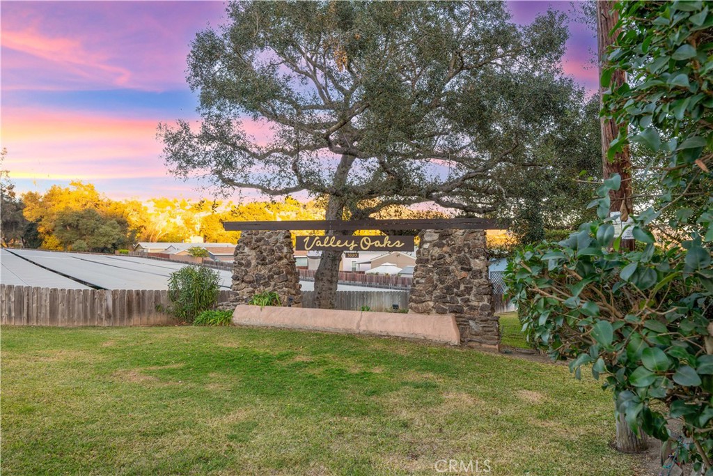 3909 Reche Road, Unit 60 Fallbrook, CA 92028 - Photo 37 of 37 a view of a garden with a building in the background