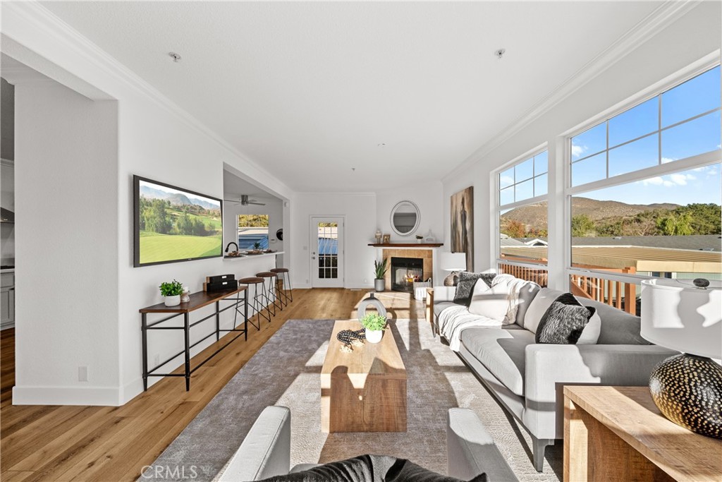 3909 Reche Road, Unit 60 Fallbrook, CA 92028 - Photo 5 of 37 a living room with furniture a large window and a flat screen tv