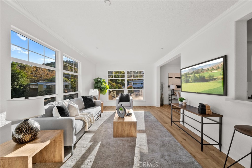 3909 Reche Road, Unit 60 Fallbrook, CA 92028 - Photo 6 of 37 a living room with furniture and a flat screen tv