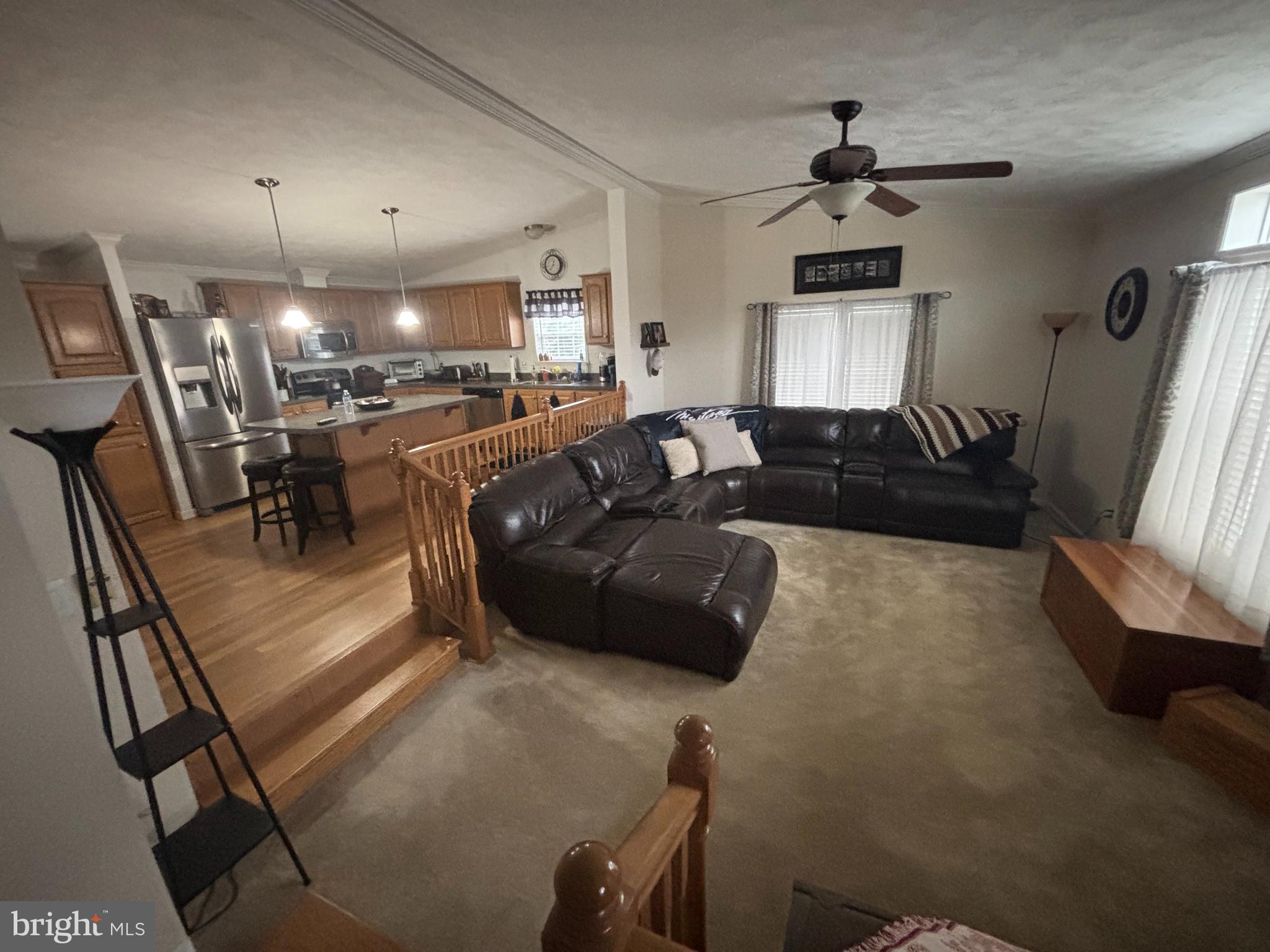 511 Sykesville Road, Unit 89 Wrightstown, NJ 08562 - Photo 3 of 12 a living room with furniture and a chandelier