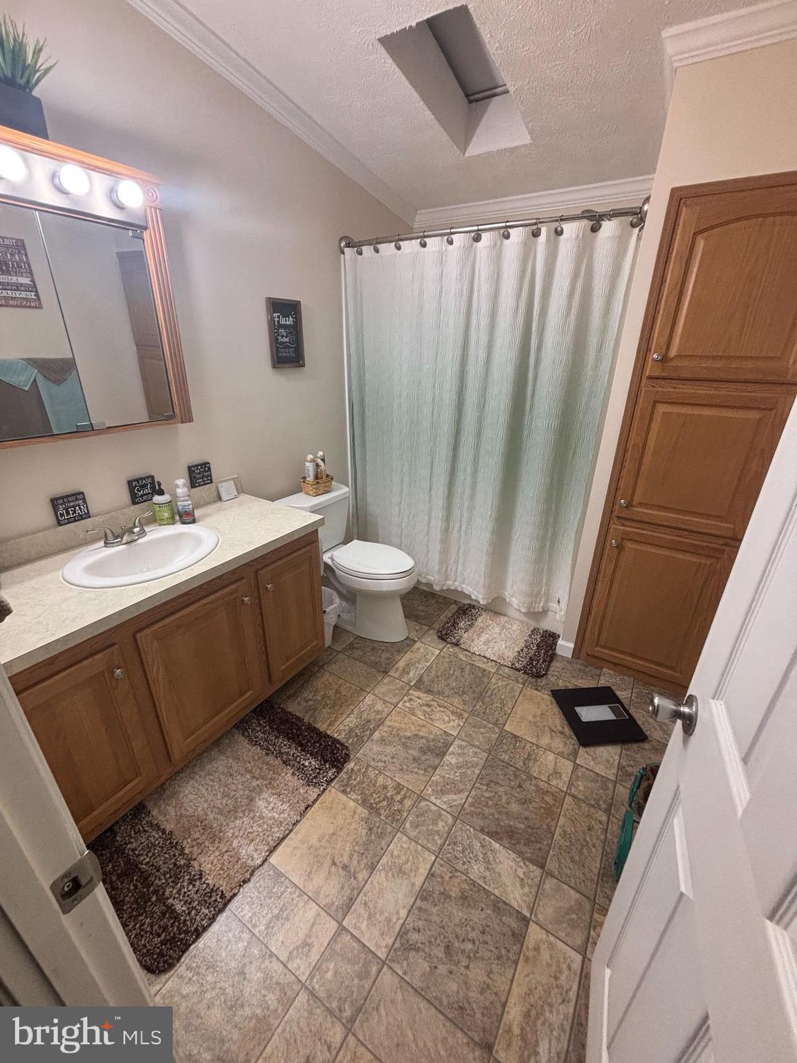 511 Sykesville Road, Unit 89 Wrightstown, NJ 08562 - Photo 8 of 12 a bathroom with a granite countertop sink and a mirror
