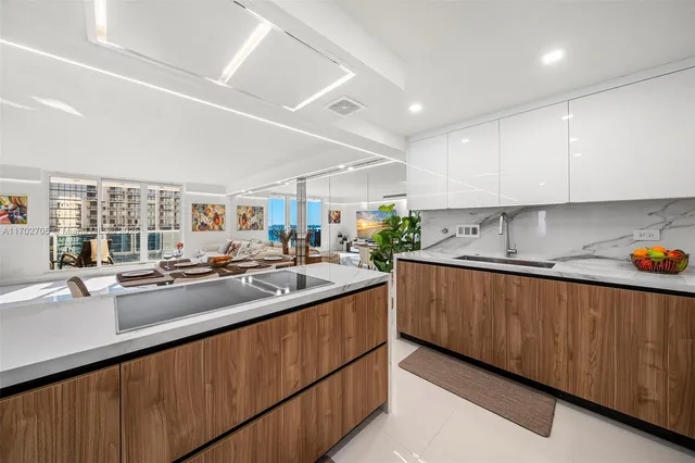 a kitchen with stainless steel appliances lots of counter top space and cabinets