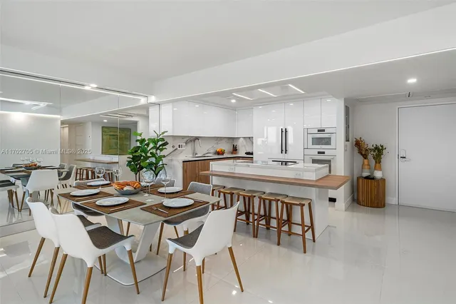a kitchen with a table and chairs in it