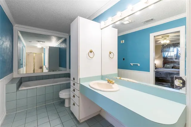 a bathroom with a tub and a mirror