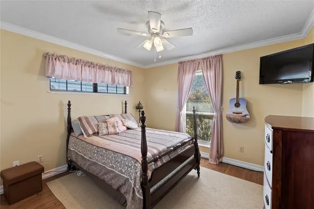 a workspace with furniture and chandelier fan