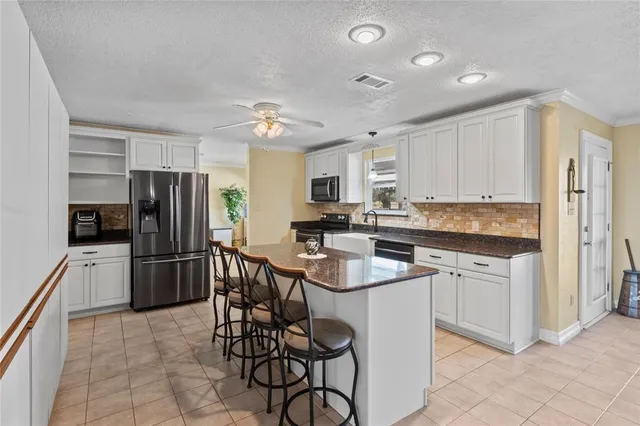 a kitchen that has a cabinets counter space and appliances