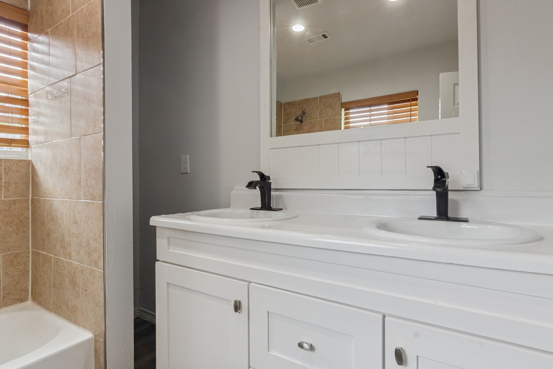 4505 Cochran Street Houston, TX 77009 - Photo 15 of 25 a bathroom with a sink and mirror