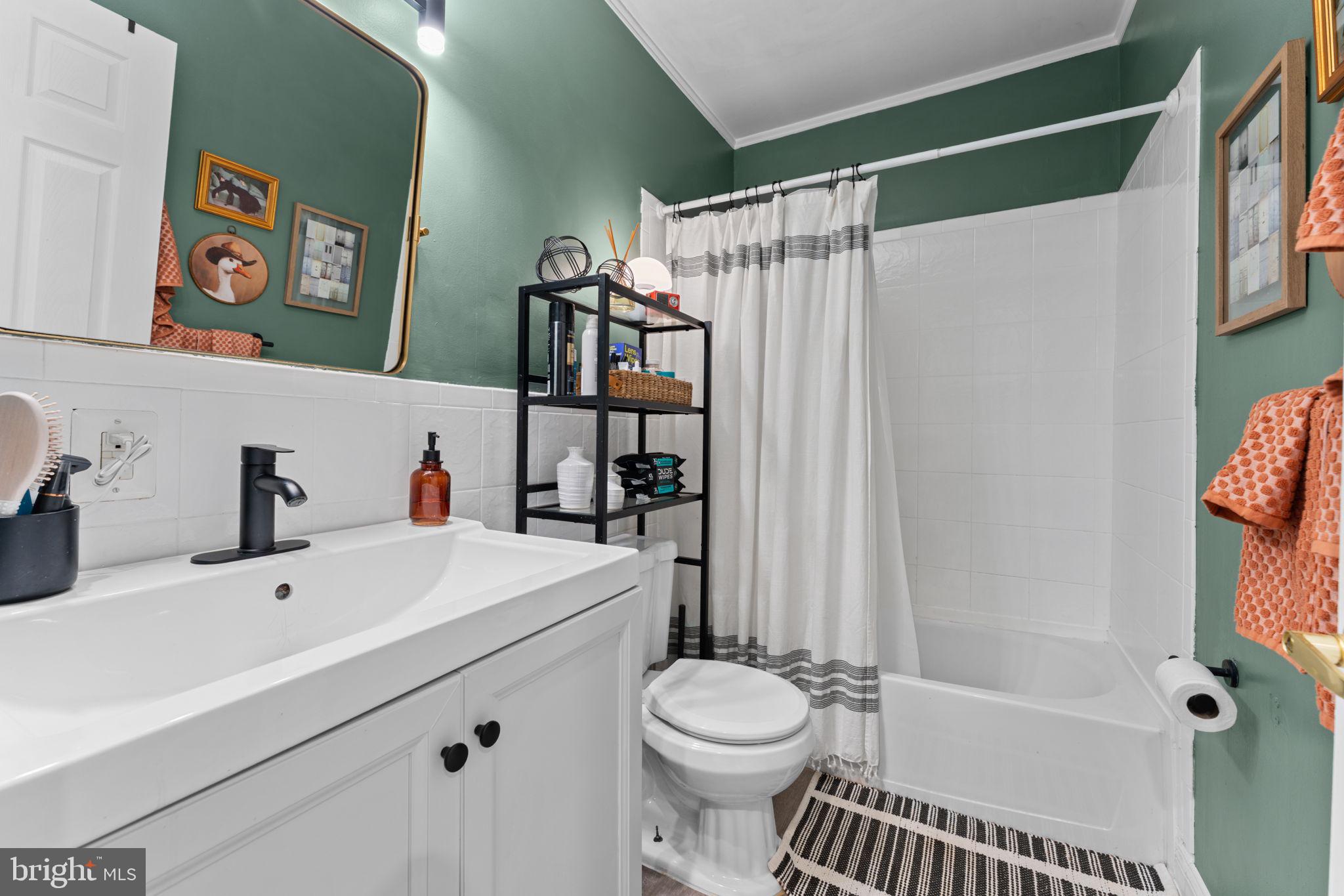 1219 Holbrook Terrace Northeast, Unit 3 Washington, DC 20002 - Photo 9 of 14 Charming bathroom with vibrant accents.