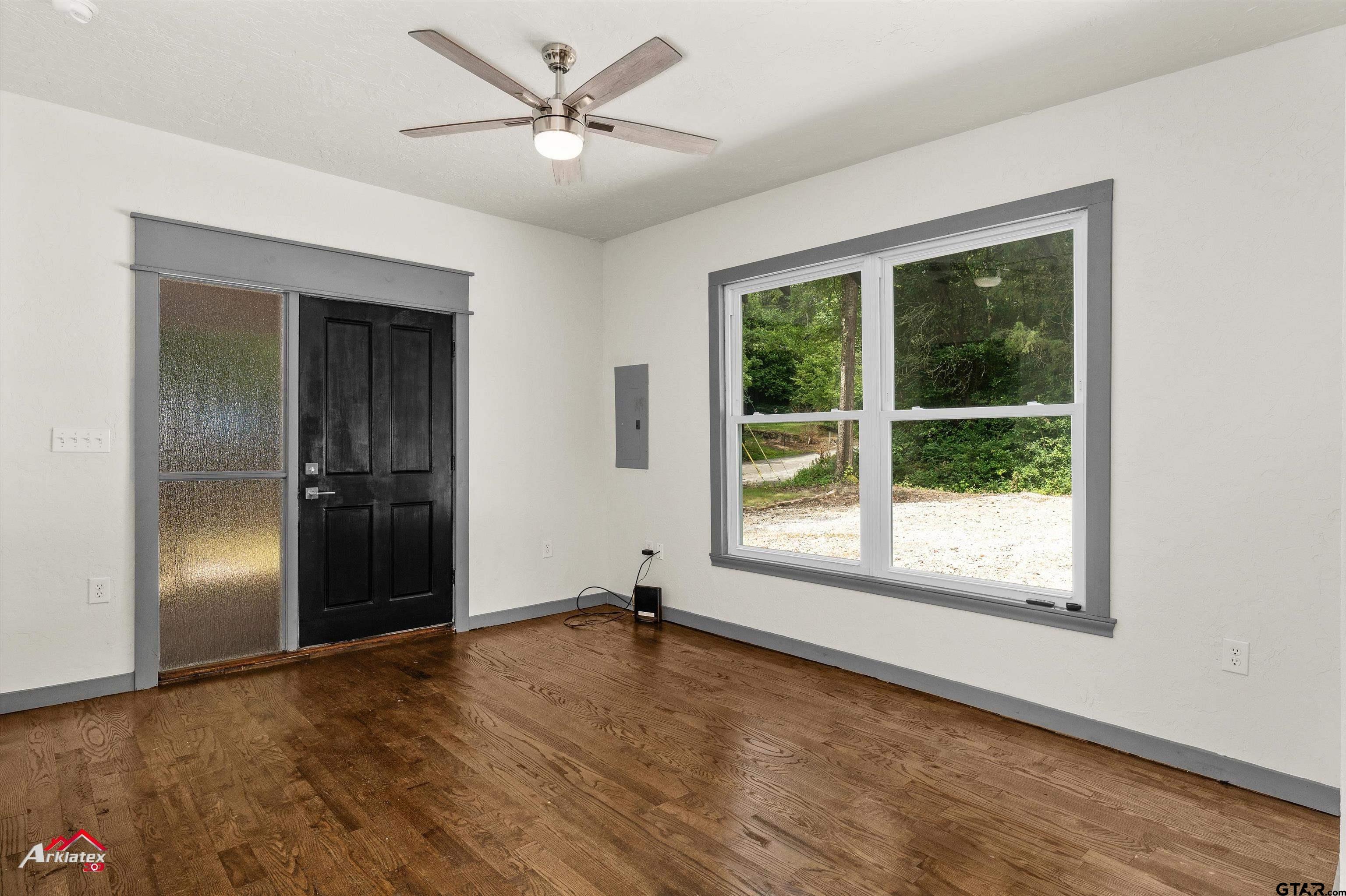 200 Jenkins Street Henderson, TX 75652 - Photo 12 of 25 a view of empty room with wooden floor and fan