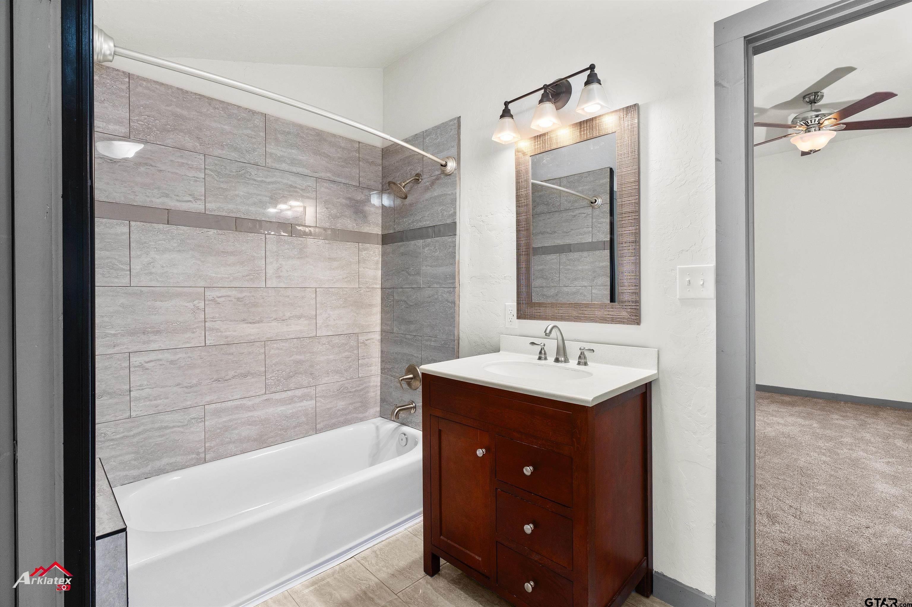 200 Jenkins Street Henderson, TX 75652 - Photo 20 of 25 a bathroom with a sink and a mirror