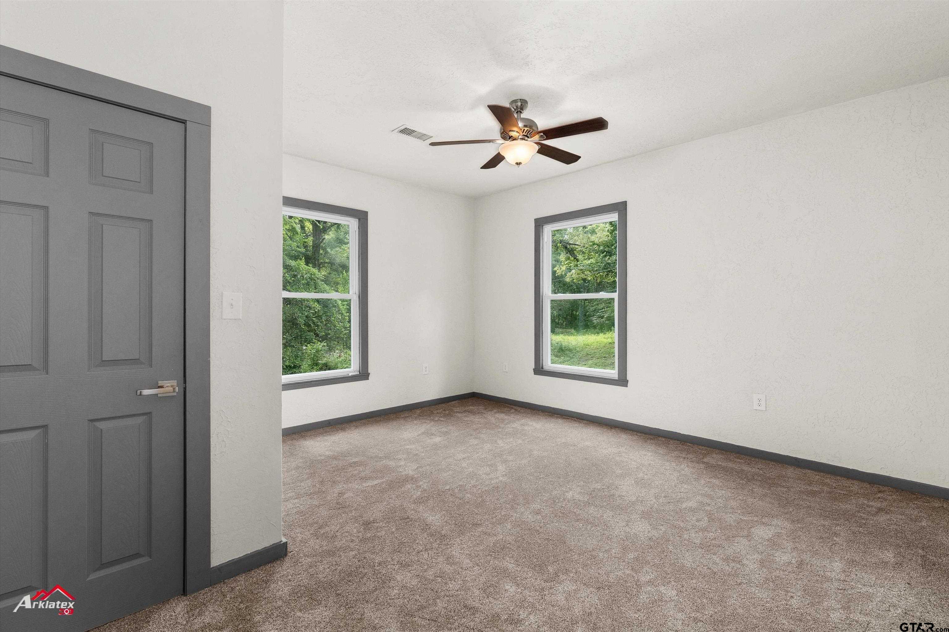 200 Jenkins Street Henderson, TX 75652 - Photo 21 of 25 a view of room with window and ceiling fan