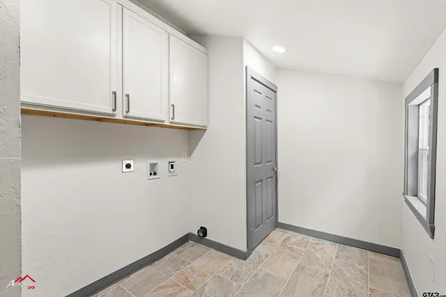 a view of a utility room with closet